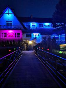 a walkway leading to a house at night at Noclegi Hexe in Żegocina