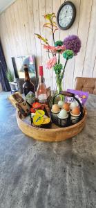 a table with a tray of eggs and a clock at Vakantiehuis De Bunker in Julianadorp