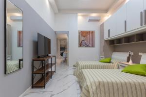 Televízia a/alebo spoločenská miestnosť v ubytovaní Mini Loft San Carlo a 5 min da MAMbo Bologna