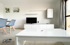 A television and/or entertainment centre at B-Rent El Royal Corralejo