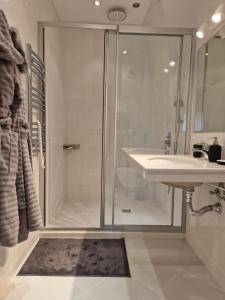 Koupelna v ubytování АПАРТАМЕНТ RESORT SENSATION 2