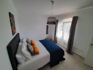 Posteľ alebo postele v izbe v ubytovaní Casa Amor Costa Teguise