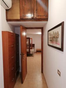 a hallway leading to a room with a closet at Princess House Palermo - Intero Appartamento - Mondello in Mondello