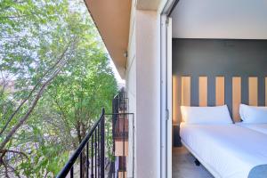 Postel nebo postele na pokoji v ubytování Smart Hotel La Sagra + 37 fotografií