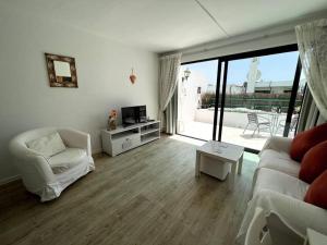 Televízia a/alebo spoločenská miestnosť v ubytovaní Casa Perdy, beautiful 1 bedroom apartment with communal pool