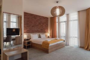 Postel nebo postele na pokoji v ubytování Hotel London