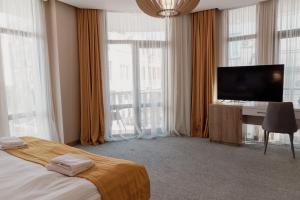 TV a/nebo společenská místnost v ubytování Hotel London