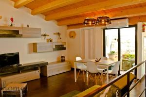 a kitchen and dining room with a table and chairs at Casa vacanza home Ragusa in Ragusa