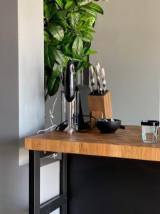 a table with a mixer and a plant on it at La Vista Barolo in La Morra in La Morra
