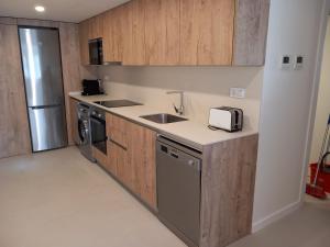 a kitchen with a sink and a counter top at Vora Salou in Salou