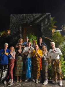 a group of people posing for a picture at Villa Danu in Kintamani