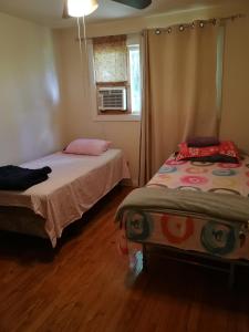Een bed of bedden in een kamer bij 320 Happy Home