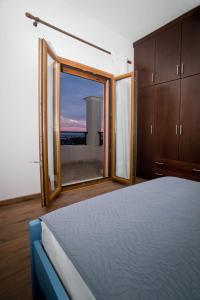 Postel nebo postele na pokoji v ubytování Persephone's Villa