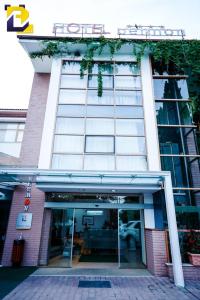 a building with an entrance to a building at Hotel Bermon in Tirana