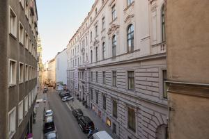 a view of a city street with buildings and cars at Cosy & Charming In The City Centre in Vienna