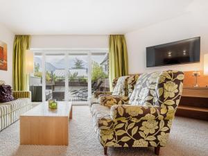 TV a/nebo společenská místnost v ubytování Alpen-Comfort-Hotel Central