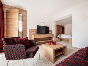 TV a/nebo společenská místnost v ubytování Alpen-Comfort-Hotel Central