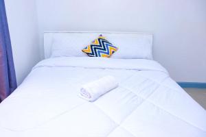 Postel nebo postele na pokoji v ubytování Homely Homestays
