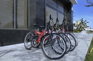 a row of bikes parked in front of a building at Hoya Hotel Taitung in Taitung City