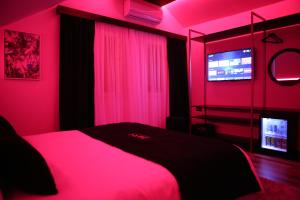 Postel nebo postele na pokoji v ubytování Dark Boutique Hotel