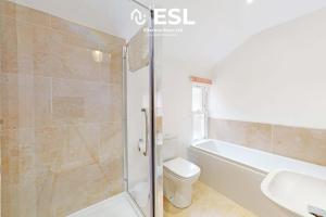 a bathroom with a shower and a toilet and a sink at 5 Bedroom House - Ideal for Groups & Contractors in Shrewsbury