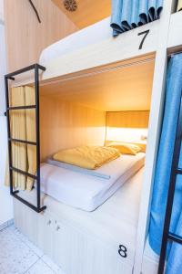 a bunk bed in a bunk bedded room in a house at Boutique Hostel Angel in Ljubljana