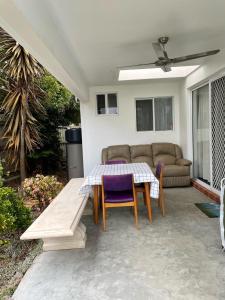 a patio with a table and chairs and a couch at Resonance in Lucknow