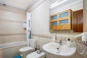 a bathroom with a sink and a toilet at Isla Bonita San Juan Beach in Guía de Isora +30 photos