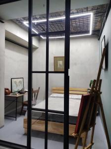 a room with a bunk bed and a desk at Shared flat in an artists district Pikris Gora in Tbilisi City