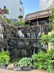 A garden outside Jardines - Tisaya 11 POOL VIEW & TWIN BEDS 1B