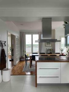 a kitchen with a sink and a counter top at Luxury villa with stunning view in Pargas +11 photos