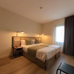 Postel nebo postele na pokoji v ubytování Hotel Marfany