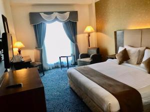 Letto o letti in una camera di Hotel Kaisar
