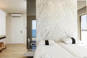 Un ou plusieurs lits dans un hébergement de l'établissement Kahlua Sea View Suites
