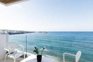 a room with a view of the ocean at Kahlua Sea View Suites in Hersonissos