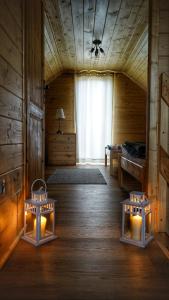 a room with two beds and two lights in it at Ostoja Ldzań in Ldzań