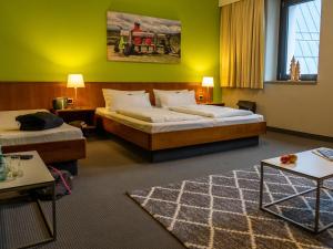 Postel nebo postele na pokoji v ubytování k1 sporthotel - Bike & Ski inklusive Hotel + 37 fotografií
