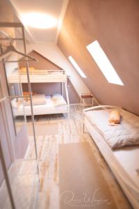 a room with bunk beds in a attic at Historia Hotel in Neustadt an der Weinstraße