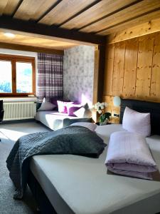 a bedroom with three beds in a room at Haus Hubertus Pitztal Winterbuchung für Wintersaison oder Sommerbuchung mit Sommercard möglich in Jerzens