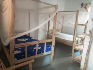 Postel nebo postele na pokoji v ubytování New Iddi Villa