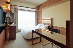 Postel nebo postele na pokoji v ubytování Candeo Hotel Utsunomiya