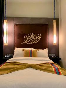 Un pat sau paturi într-o cameră la Villa Margaux