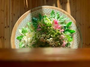 a bouquet of flowers sitting on a table at Karczma Leśniczanka in Wielbark