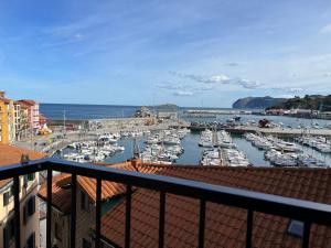 a view of a marina with boats in the water at IZARO EYE BERMEO by Urdaibai Rentals in Bermeo