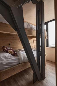 Divstāvu gulta vai divstāvu gultas numurā naktsmītnē CasaNevada - La mejor casa de Sierra Nevada - Apartamento de lujo