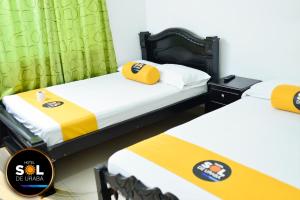 Postel nebo postele na pokoji v ubytování Hotel sol de uraba