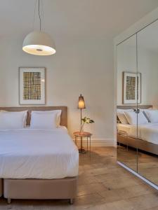 Кровать или кровати в номере Be Mate Casa Di Bava