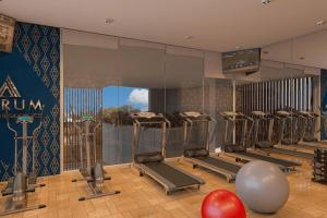a gym with a row of treadles in a room at Apartment with Pool & Gym in Colombo