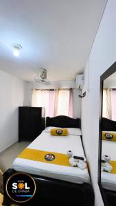 Ein Bett oder Betten in einem Zimmer der Unterkunft Hotel sol de uraba