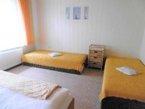 Postel nebo postele na pokoji v ubytování Ruegen_Fewo 58_1